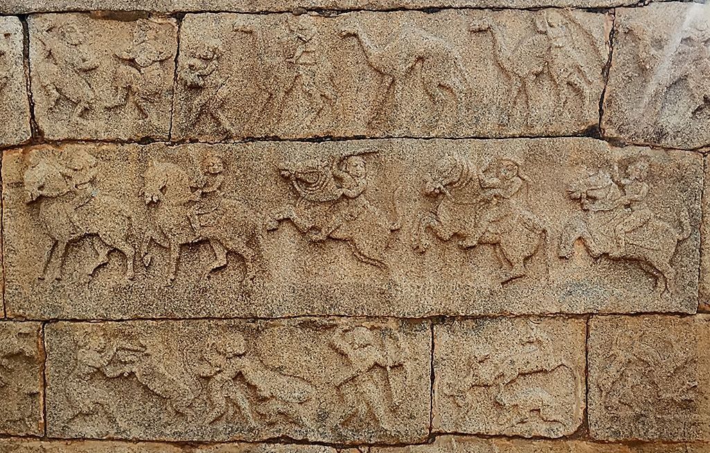 Hampi stone carvings of hunters, horsemen, and camels