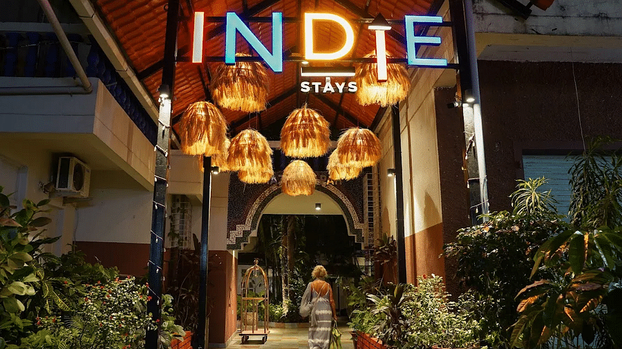 Entrance with a board sign to Indie Stays Resort, Goa