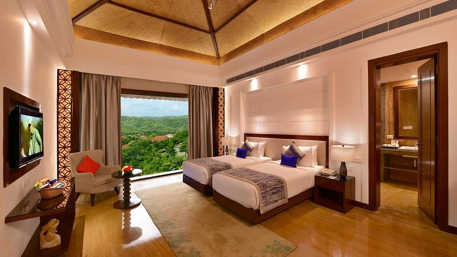 An overview of the room inside the Grand suite with a twin bed - Ananta Udaipur