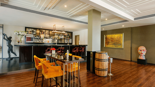 a table kept next in front of the bar area at AKs Bar - Karma Lakelands.