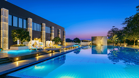 the Swimming Pool with evening sky in the background at Karma Lakelands.