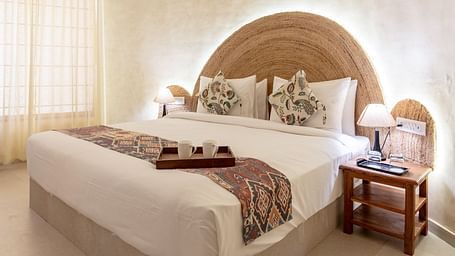 A room with a bed and a side table beside it at Valley by Grassfield.