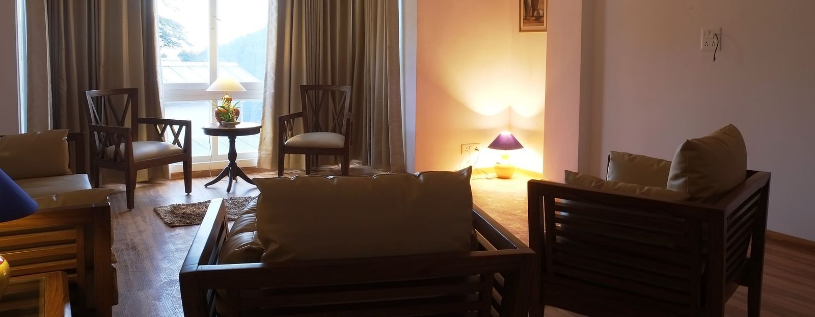 Bedroom apartment featuring a wall light in the corner.