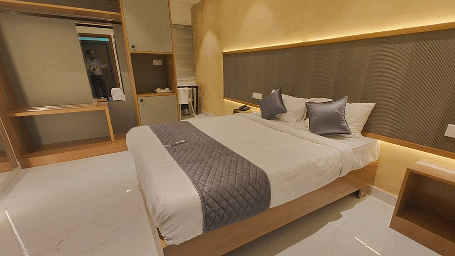 a view of the king sized bed of the room at hotel La Premier 