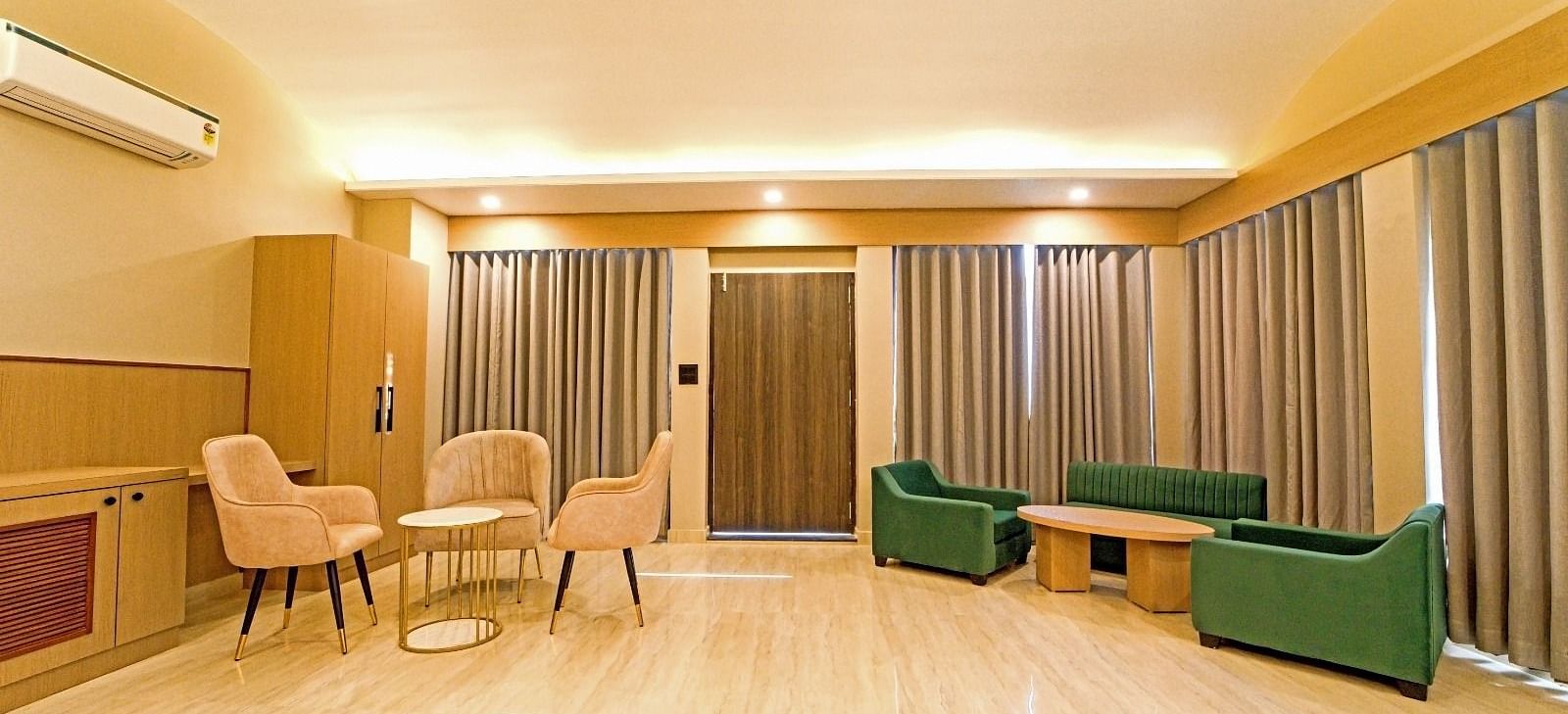 Spacious area at Grassfield Riveria Resort, Jaipur, with comfortable seating, large windows, and ambient lighting.