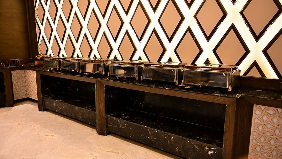 A row of neatly arranged buffet boxes ready for service at BluSalzz Residence, Amritsar.