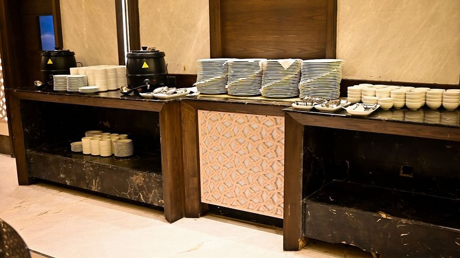 Cutlery elegantly arranged on a rustic wooden table at BluSalzz Residence, Amritsar