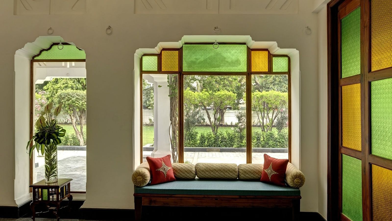 Lobby area of Saraca Hotel, Lucknow with coloured panes on the windows