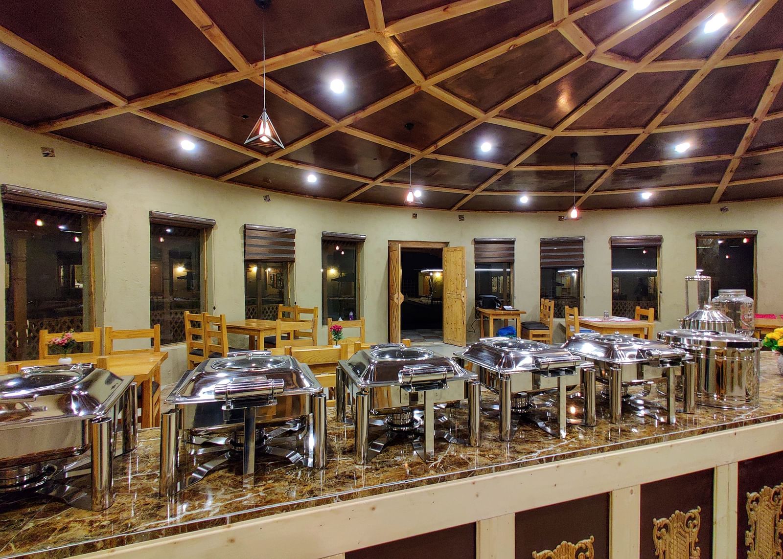A closer view of the buffet setup at dining area at White Sands Resort, Ladakh showcasing the variety of food and serving dishes available.