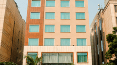 Facade of Nemesia Hotel in Guegaon 1