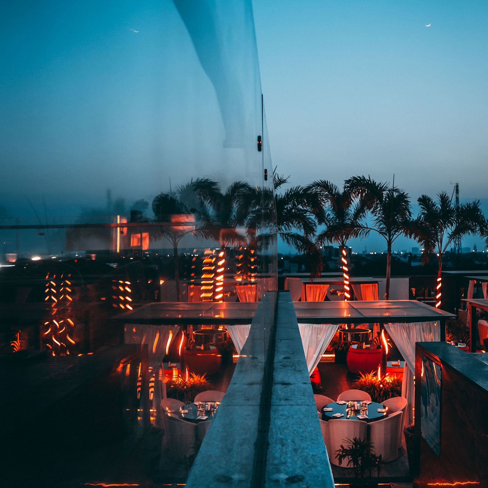 a view of a restaurant near Marina Beach with the infinity pool in front and city views visible on the edge - Hotel Park Elanza, Chennai