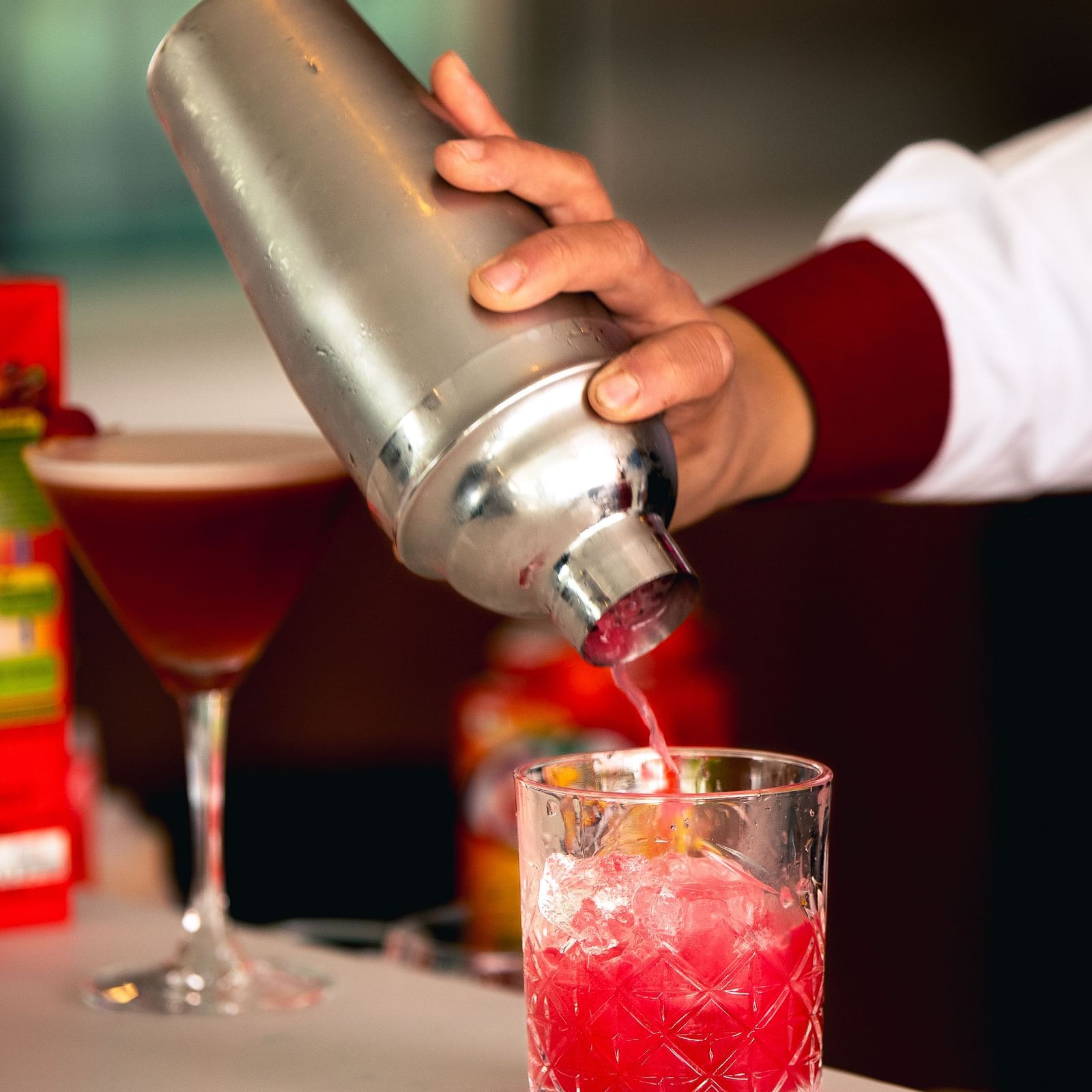 Close up shot of a drink being poured into a glass on a counter at Mandala Norling Lords Prime in Kathmandu.