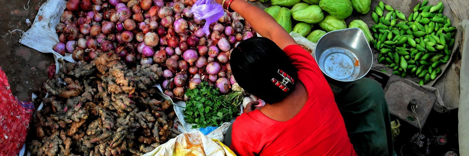 A women selling vegetables at a shop