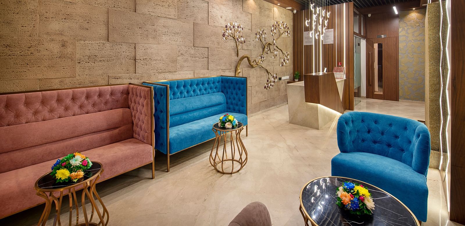 A view of the hotel lounge with a neat seating arrangement - SK Lords Inn Ahmedabad
