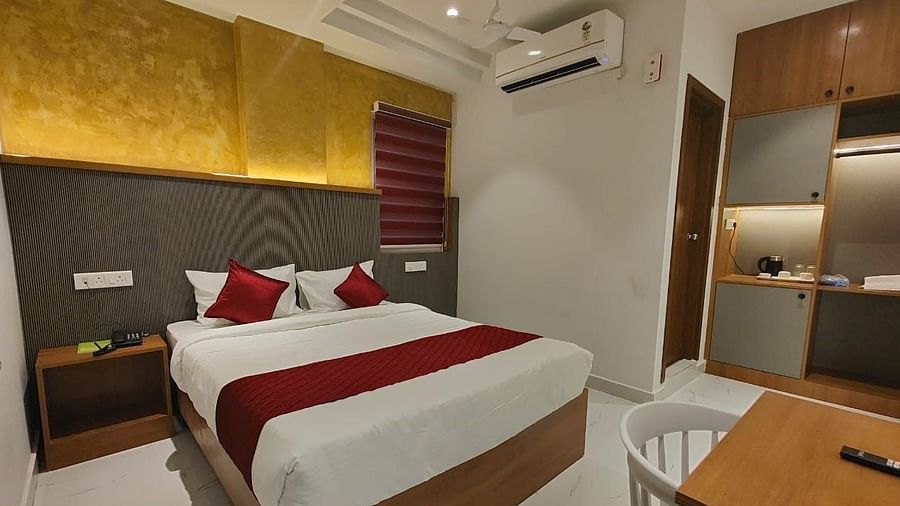 A view of the large bed at  Hotel La Premier