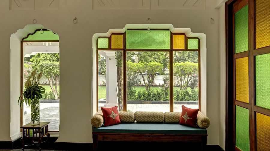 Lobby area of Saraca Hotel, Lucknow with coloured panes on the windows