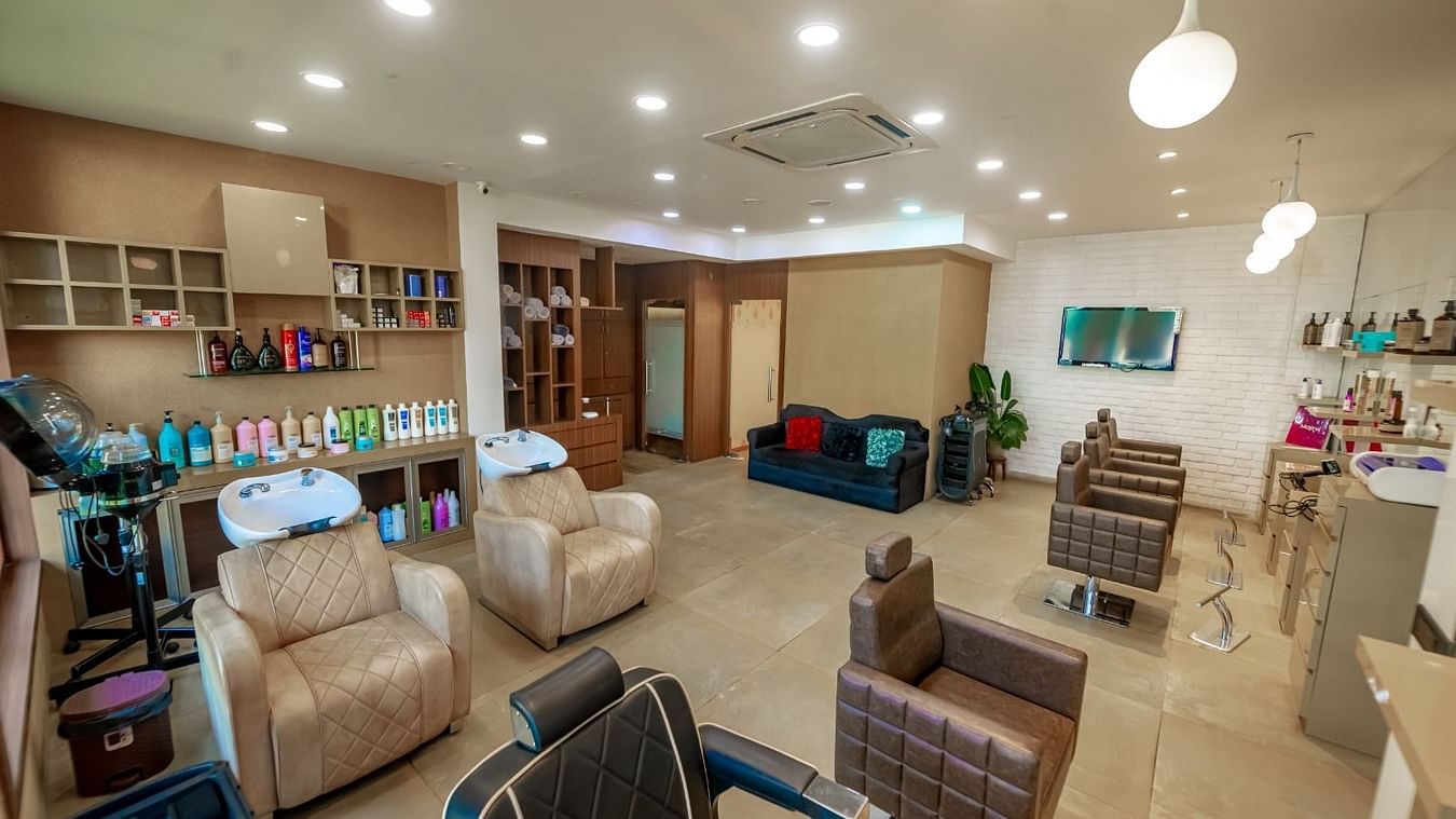Overview image of a IOSIS Spa & Wellness Raipur with massage chairs and other salon equipments