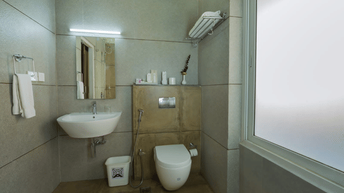 A bathroom is equipped with a sink and toilet, providing essential facilities. - Abad Brookside Lakkidi, Wayanad
