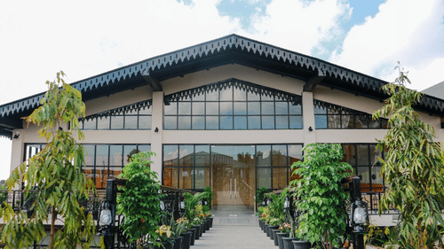View of Mausmai Ballroom with a grid-structured glass façade, flooding the space with natural light and offering stunning outdoor views