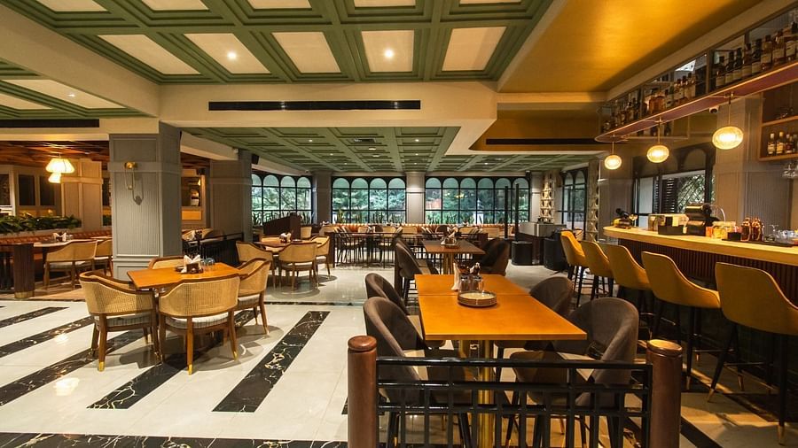 An image of Tring Tring Restaurant and Bar at Hotel Polo Towers, Shillong, featuring decorated tables, ambient lighting, and a bar counter.