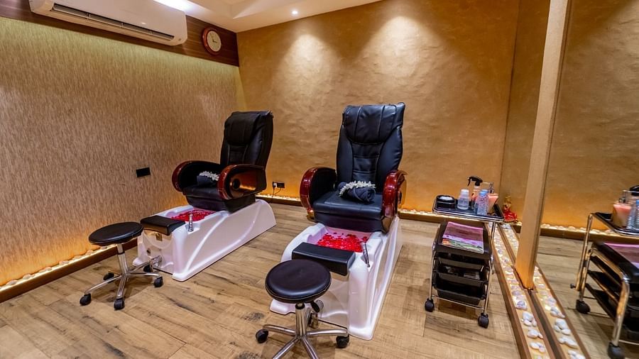 pedicure station with two chairs and an ac wall mounted - IOSIS Spa & Wellness