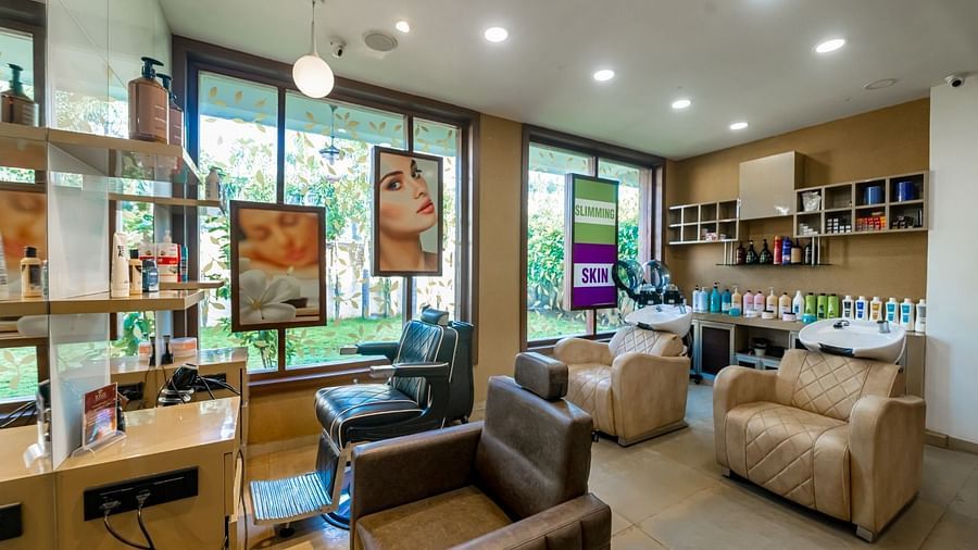 salon area with sofas in the back and chairs in the front - IOSIS Spa & Wellness