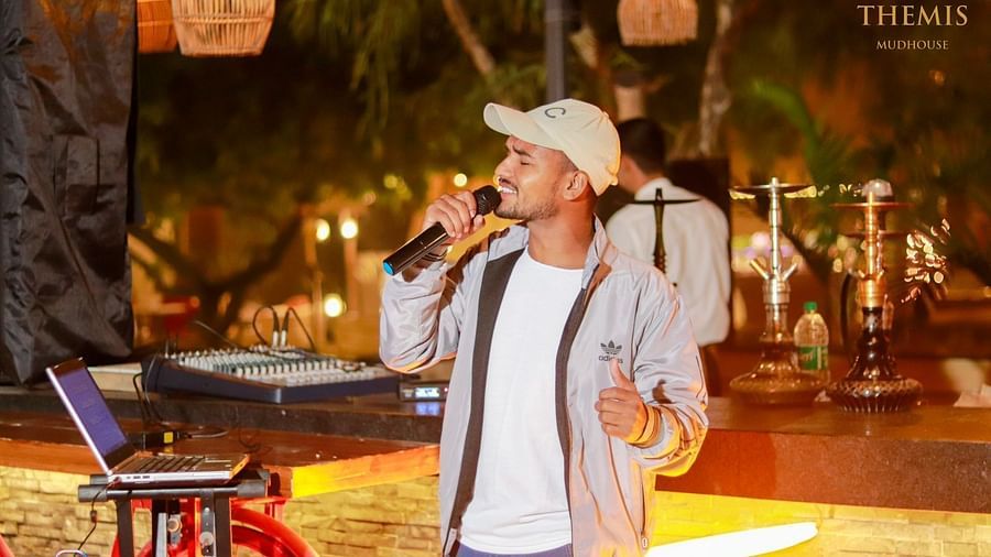 A person singing in Themis Mudhouse - A Nature's Retreat Resort & Wellness