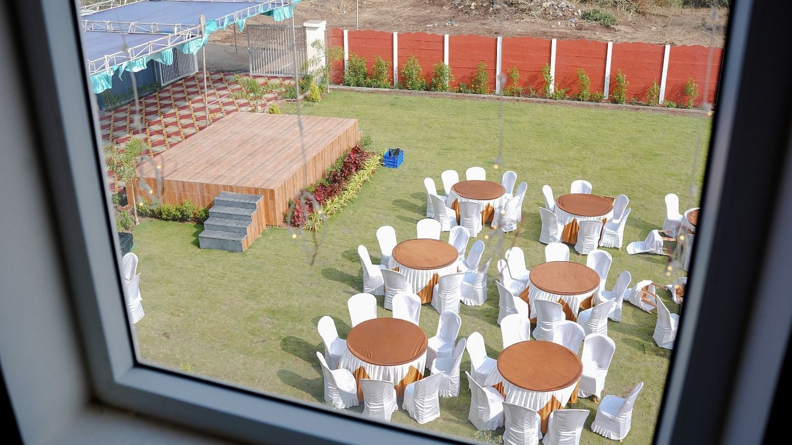 Seating  and stage arrangement in the garden area of ANS M Square Hotel & Resort, Kalaburagi