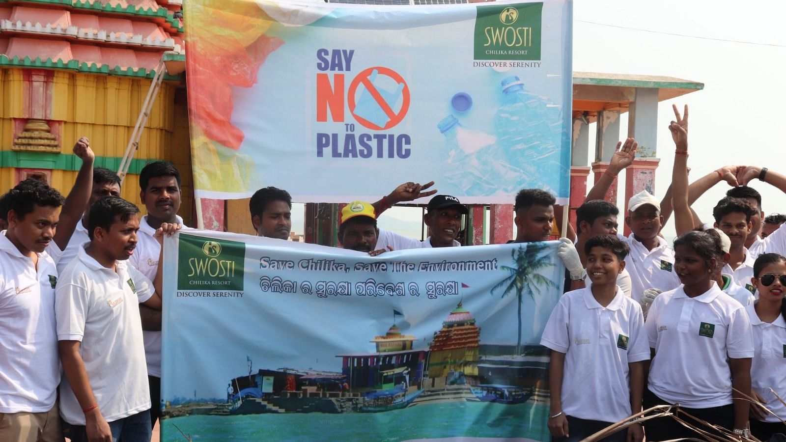 People carrying boards saying no to plastic waste