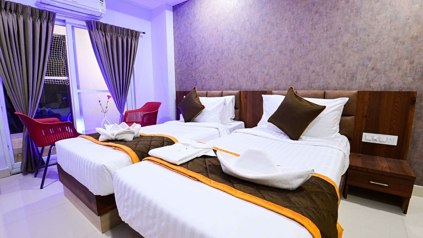 view of the twin beds of Twin Deluxe Room at South Square Hotel, Bengaluru