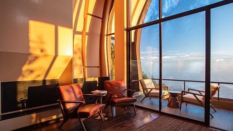 Sunlight gleaming into the room that has huge glass windows | Kavya Resort & Spa, Nagarkot