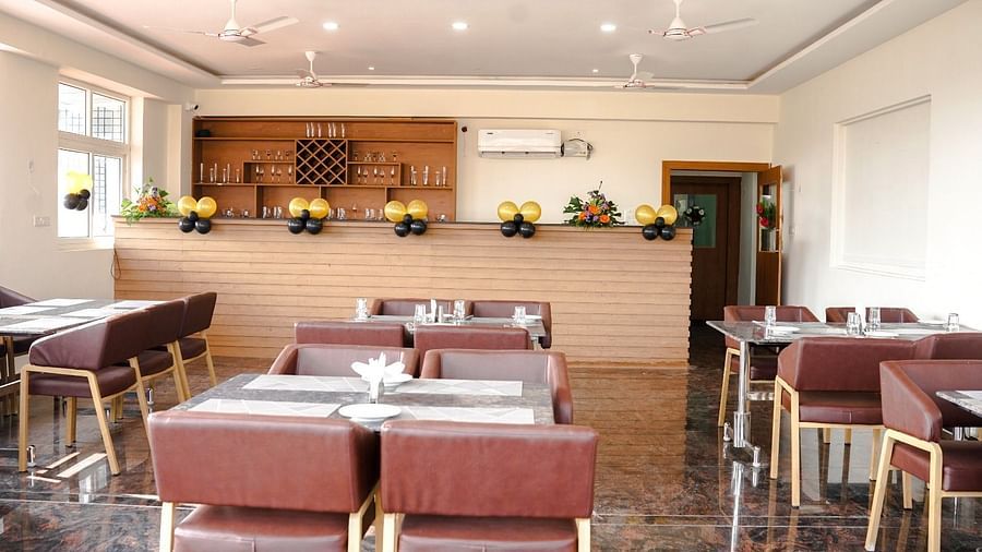 Dining arrangement in a restaurant at ANS M Square Hotel & Resort, Kalaburagi