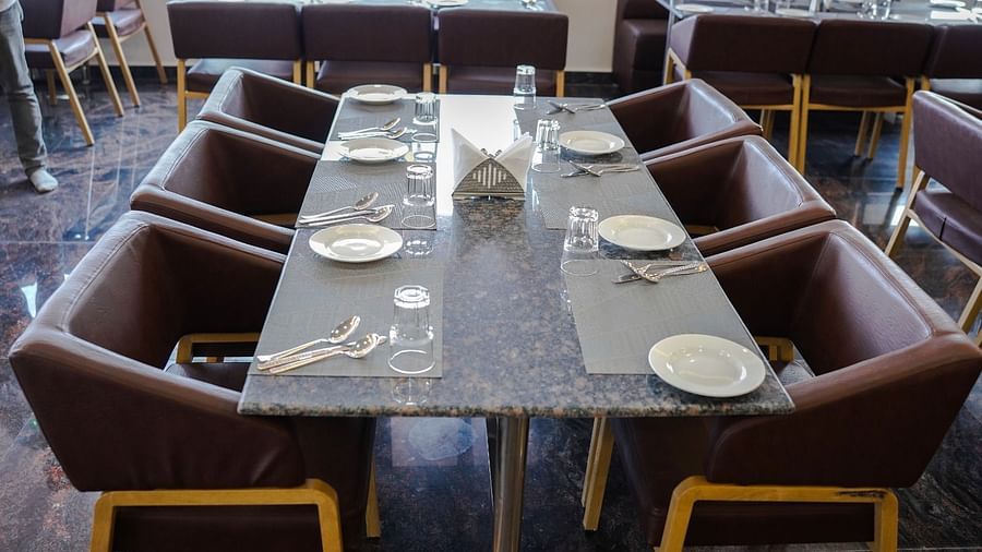 Dining arrangement in a restaurant at ANS M Square Hotel & Resort, Kalaburagi