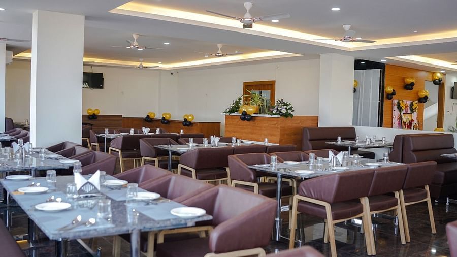 Dining arrangement in a restaurant at ANS M Square Hotel & Resort, Kalaburagi