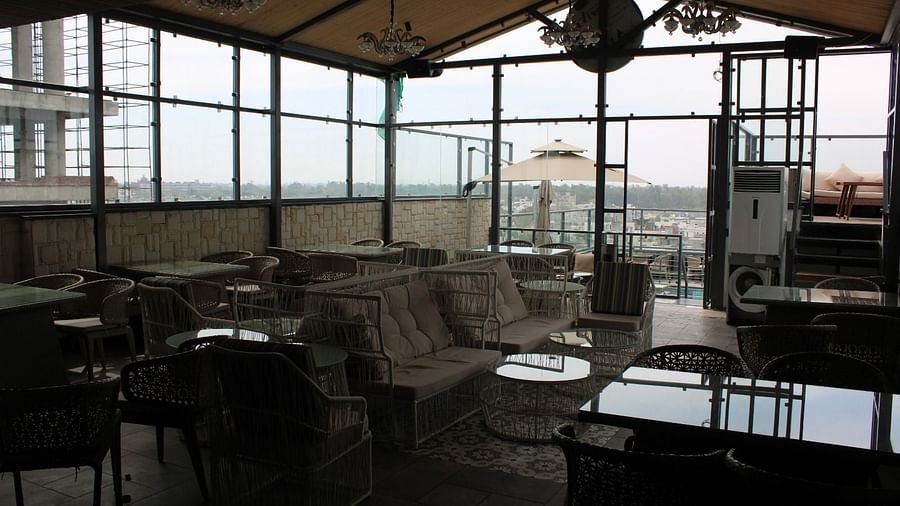 Rooftop lounge space with seating arrangements at BluSalzz Residence, Amritsar.