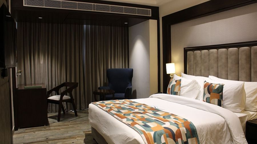 A bedroom featuring working desk and chair at BluSalzz Residence, Amritsar