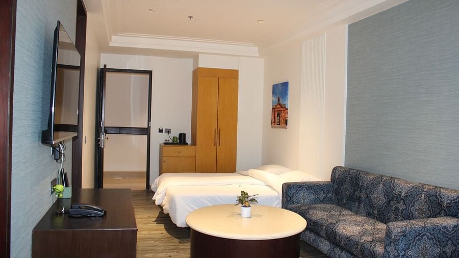 side view of living space with a coffee table and a sofa at BluSalzz Residence, Amritsar
