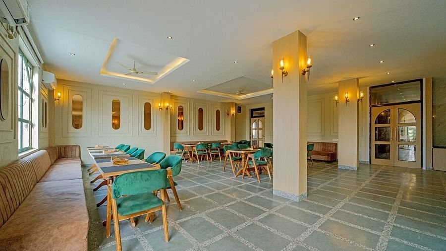 Dining area at Grassfield Riveria Resort, Jaipur, featuring stylish seating, soft lighting, and a spacious, elegant atmosphere.