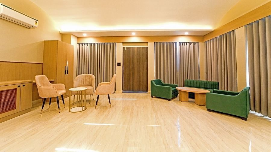 Spacious area at Grassfield Riveria Resort, Jaipur, with comfortable seating, large windows, and ambient lighting.