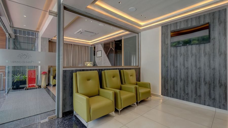 An image of a seating area with three single-seater sofas arranged at Hari Govindas, Siddappa Square.