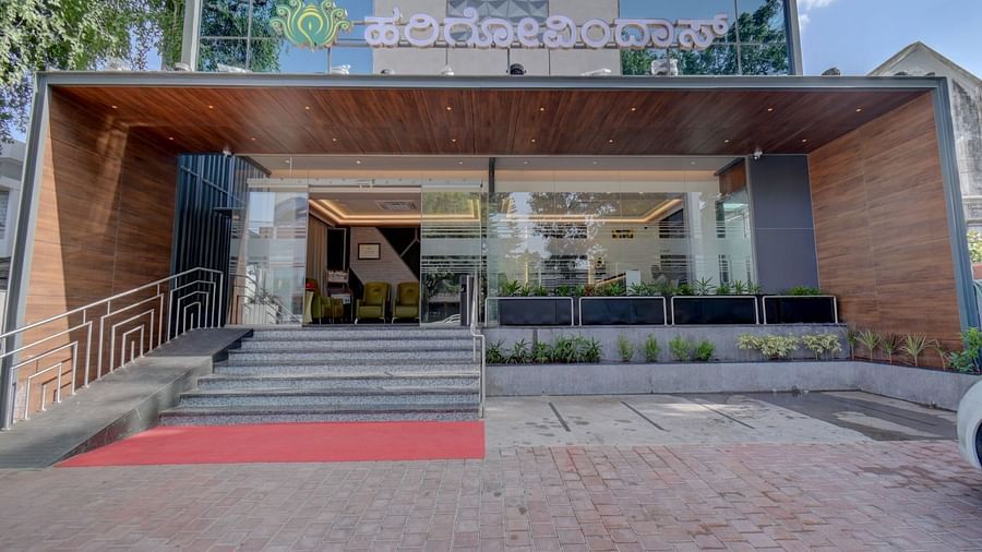 An entrance view of Hari Govindas, Siddappa Square, featuring stairs leading up to the entrance.