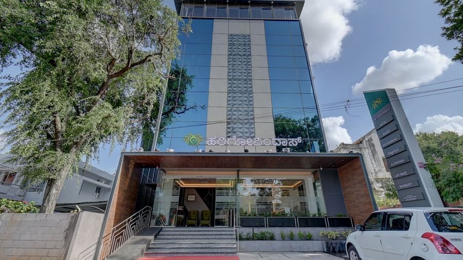 Facade of Hari Govindas, Siddappa Square with trees on the side.
