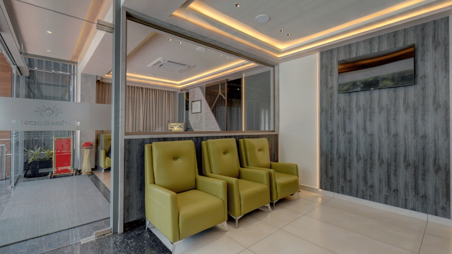 A seating area with three single-seater sofas arranged at Hari Govindas, Siddappa Square.