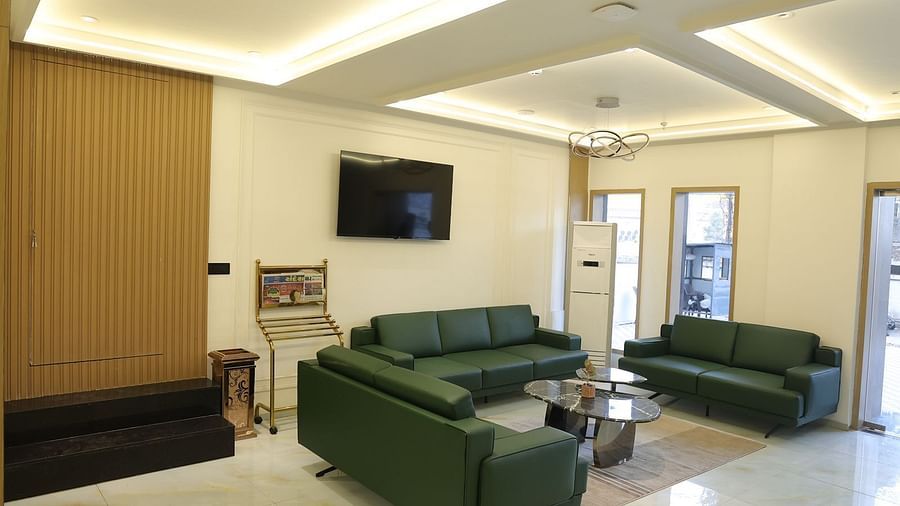 A welcoming reception area at Lords Eco inn Jamnagar Maheshwari Nagar featuring comfortable seating and a modern aesthetic.
