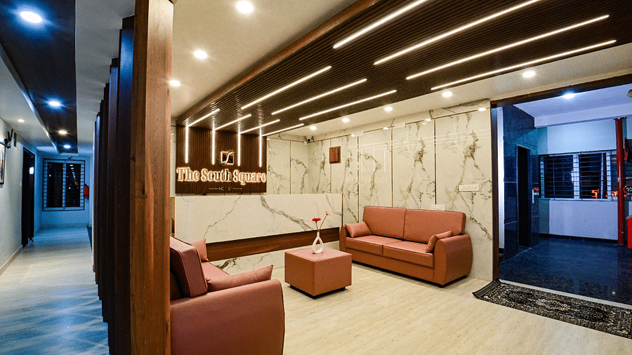 lobby area with comfortable seating of  South Square Hotel, Bengaluru