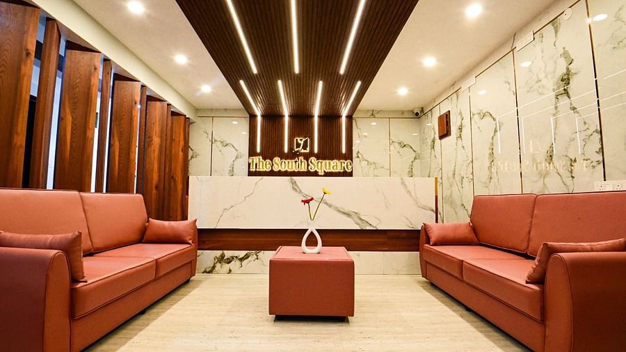 lobby area with comfortable seating of  South Square Hotel, Bengaluru