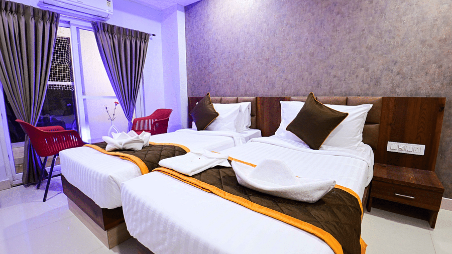 view of the twin beds of Twin Deluxe Room at South Square Hotel, Bengaluru