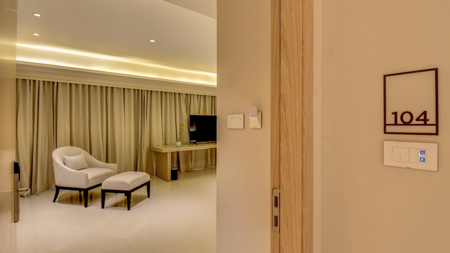 Seating area of City View Suite at The SSK Solitaire Hotel and Banquets, Mumbai Naka featuring a sofa and centre table, and a flat TV screen.