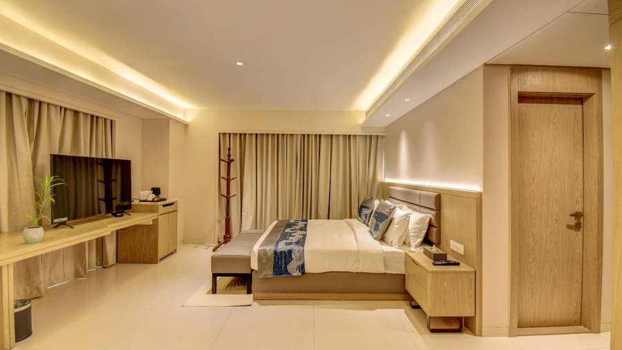 City View Suite at The SSK Solitaire Hotel and Banquets, Mumbai Naka featuring a bed, bedside table, and TV on a cabinet.