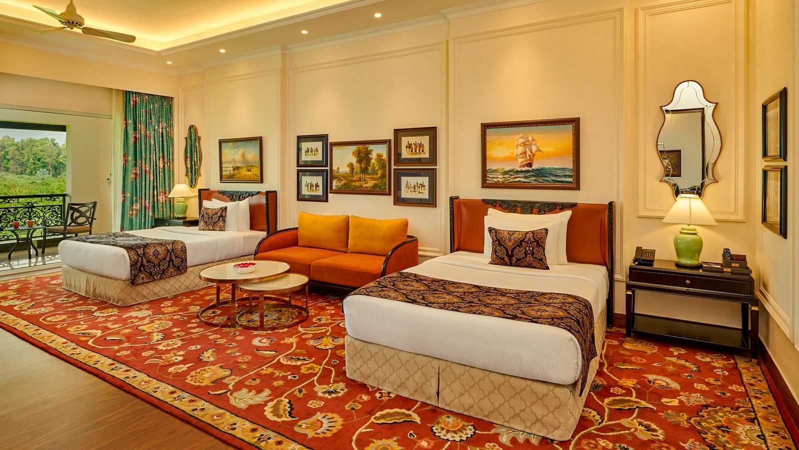 Spacious twin-bed suite with rich carpeting and vibrant seating at MAYFAIR Tea Resort, Siliguri